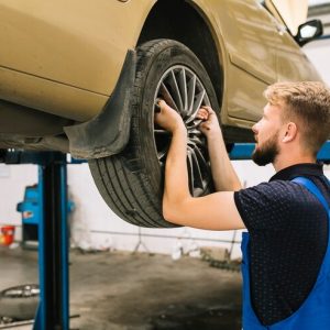 repairman-fixing-tyre-shop_23-2147897833 repairman-fixing-tyre-shop_23-2147897833
